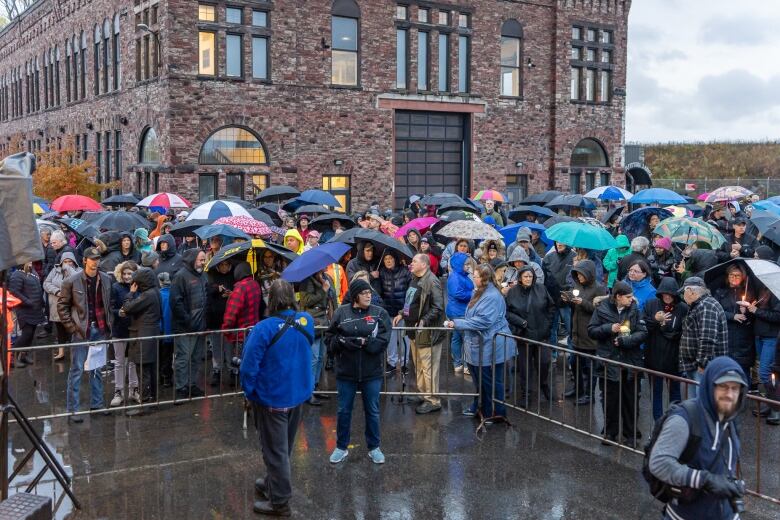 Members of the public attend a candlelight vigil for the victims of this past week's shooting deaths, in Sault Ste. Marie, Ont.