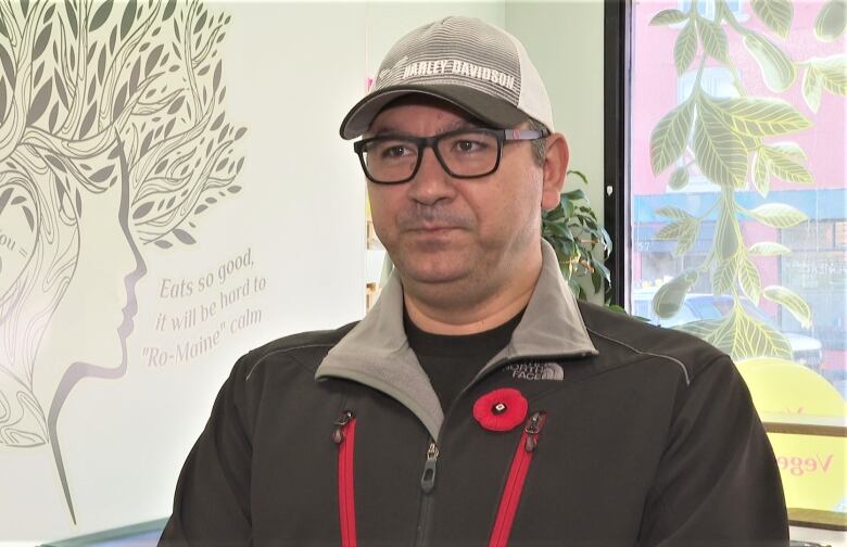 Charbel Jreij in Gaia Urban Eatery, wearing a poppy.