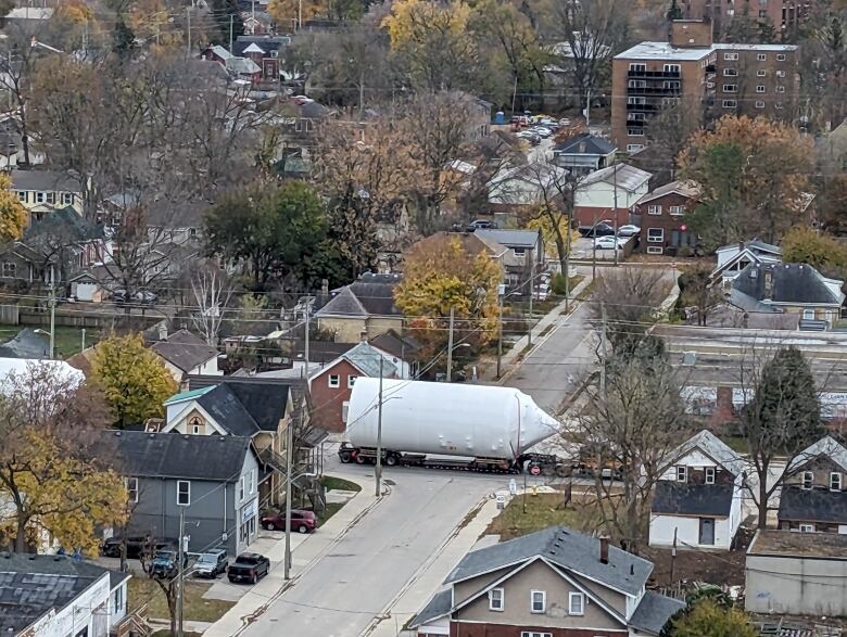 One of four giant beer tanks makes its way along Horton Street toward Labatt Brewery in London, Ont. on Nov. 8, 2023.