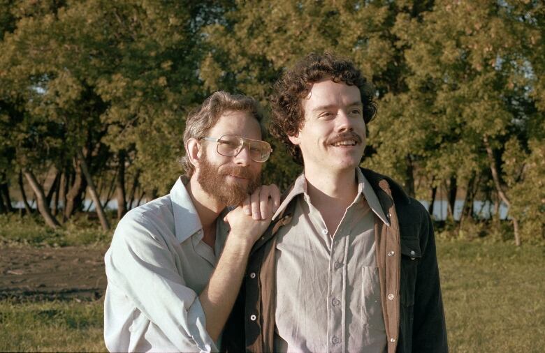 Two men embrace in an undated photo.