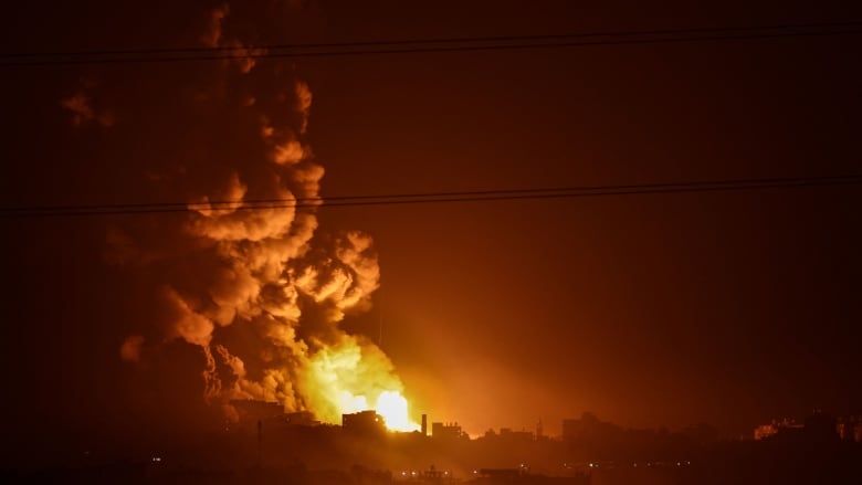 A fireball is seen erupting in the Gaza Strip during an Israeli bombardment.