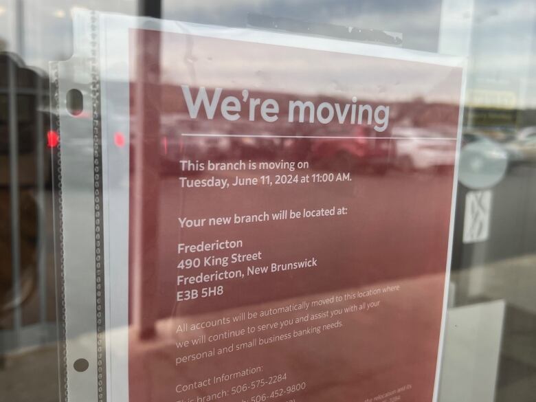 A sign saying this branch will close and customers will be moved to Fredericton.