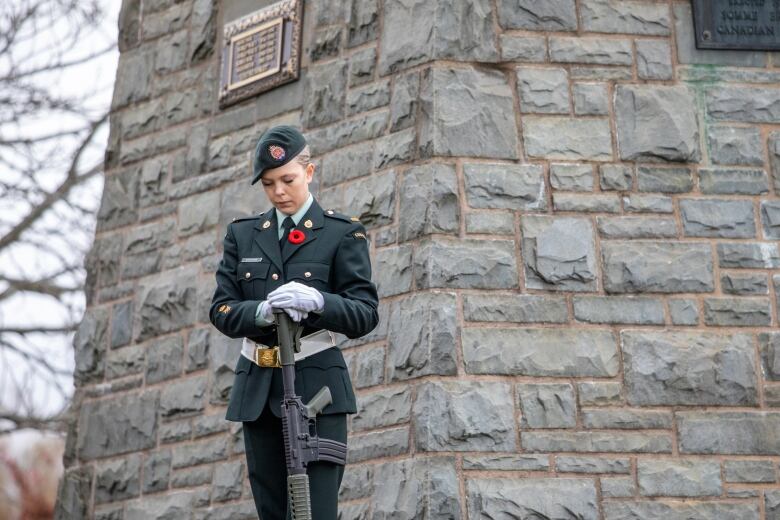 A military member in uniform looks down with a deep gaze at a Remembrance Day ceremony in Dartmouth, N.S., on Saturday, Nov. 11, 2023.