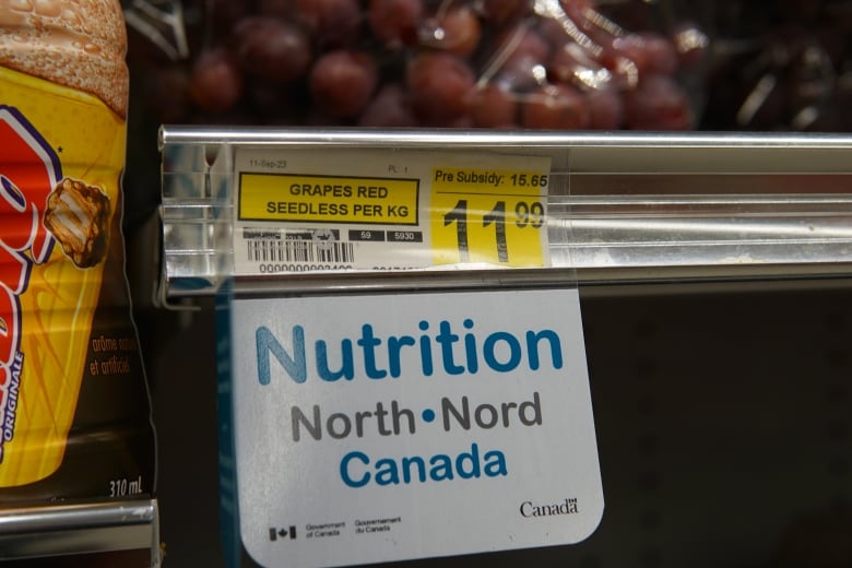 A price tag for red, seedless grapes that reads $11.99.