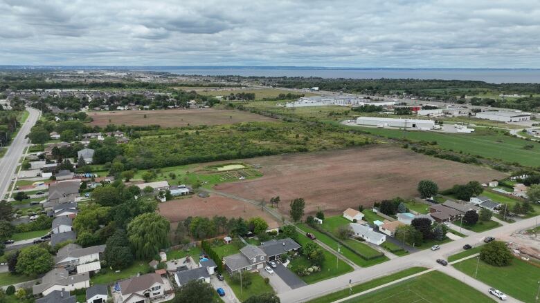 Aerial shot of houses and farmland