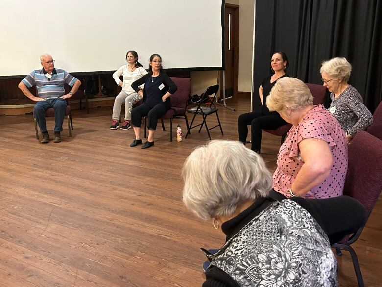 People sitting in chairs.