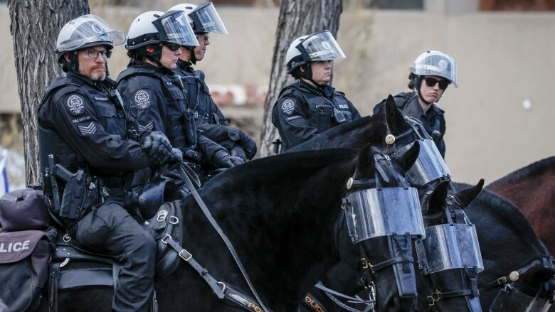 Five officers on horseback. 