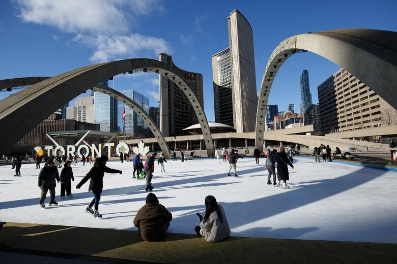 People skate on the ice rink at Nathan Phillips Square--perfect for Family Day long weekend activities--on Feb. 17, 2023. 