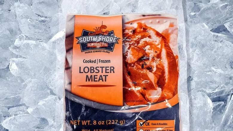 an 8oz package of cooked frozen lobster meat sits on ice. 