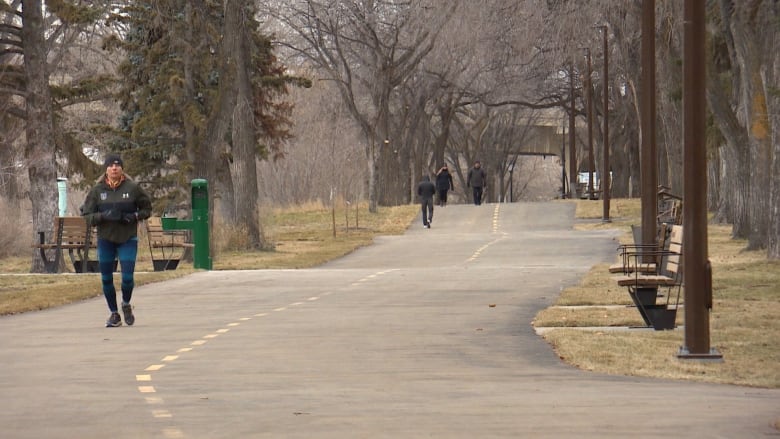 Pedestrians take advantage of dry pavement in Saskatoon's Meewasin Park.