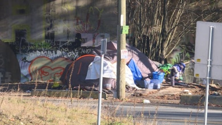 Tents by side of the road.