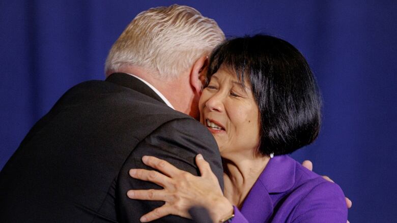 Chow smiling as she hugs Doug Ford.