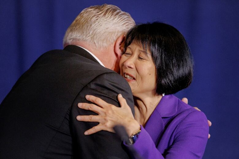 Chow smiling as she hugs Doug Ford.