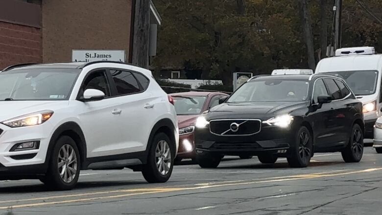 A group of vehicles are bumper to bumper on a Halifax Street.