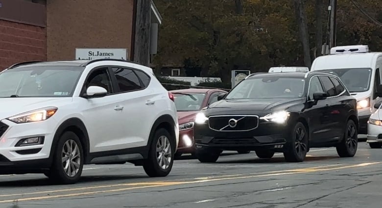 A group of vehicles are bumper to bumper on a Halifax Street.