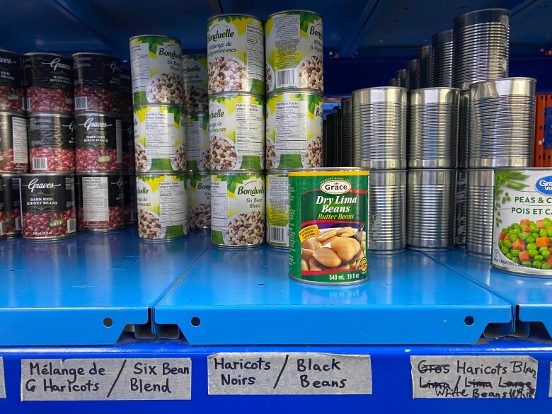 Cans sitting on a shelf at the West Island Assistance Fund food bank