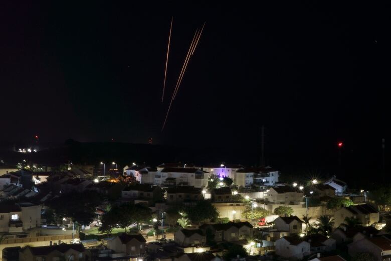 Rockets are seen being fired toward Israel from the Gaza Strip.