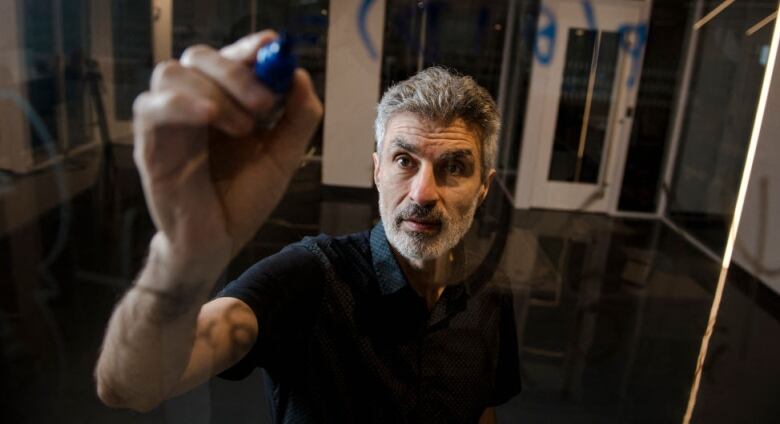 Yoshua Bengio, the scientific director at the Mila Quebec AI Institute, poses for a portrait on July 4, 2023, in Montreal, Canada. Bengio is best known for his work in machine deep learning, artificial neural networks, and most recently, his call to action to regulate AI research.  