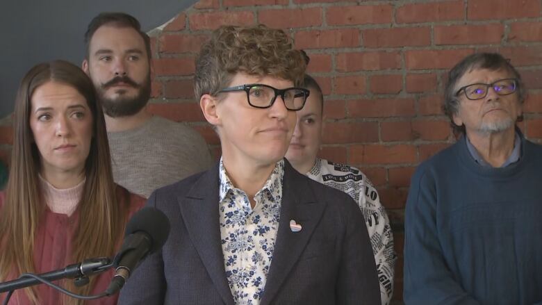 NDP housing critic Janis Irwin stood with Calgary renters while speaking about her proposed bill introduced in the Alberta legislature on Tuesday. 