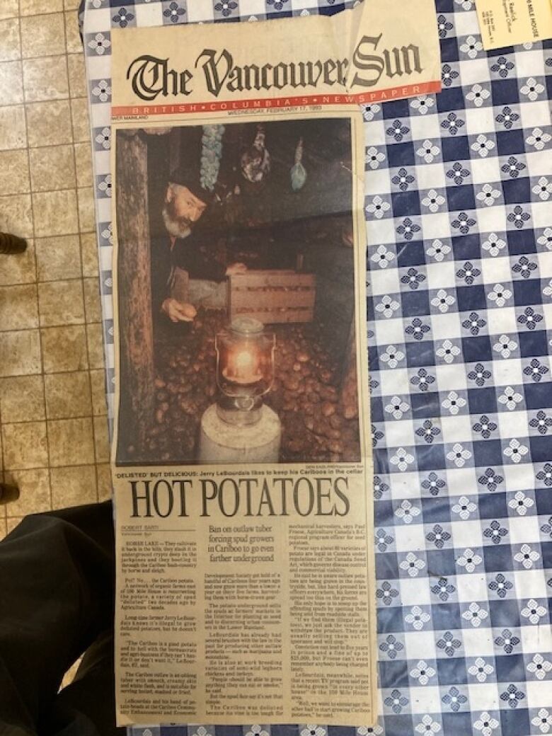 A clipping from a newspaper shows a man storing potatoes in a cellar, with the headline 'Hot Potatoes'.