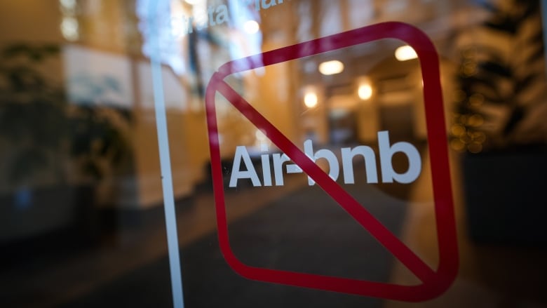 A sign indicating Airbnb rentals are not permitted is seen at the entrance to a condo tower in Vancouver on Thursday, Nov. 23, 2023.