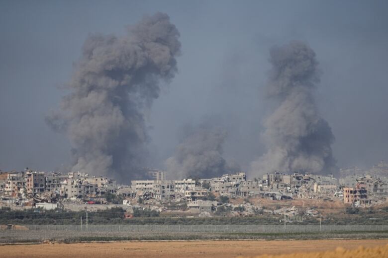 Smoke rises following an Israeli bombardment in the Gaza Strip, as seen from southern Israel on Monday, Dec. 11, 2023. 