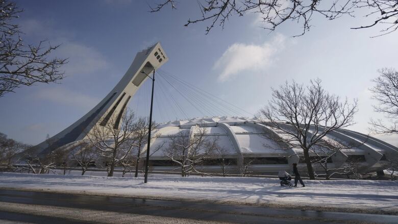 A sports stadium against a blue sky on a winter's day.