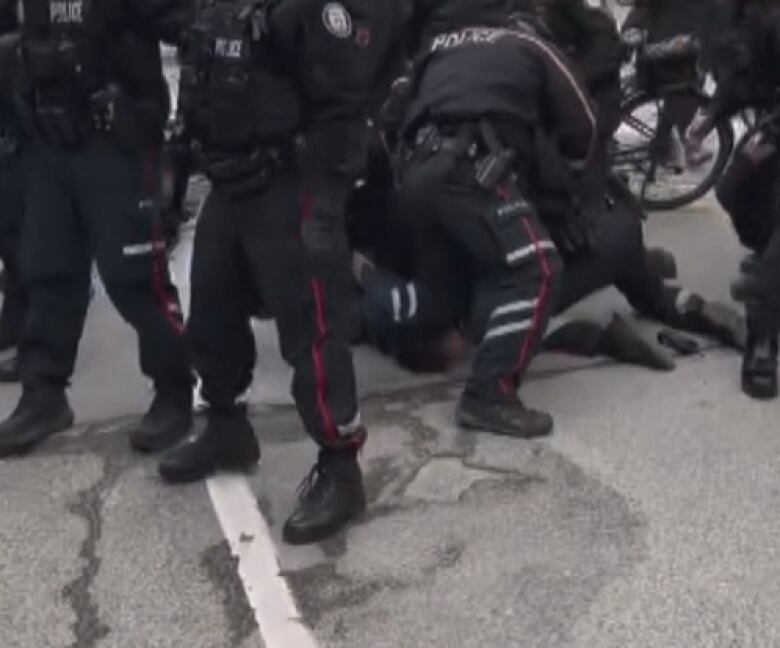 Police officers arresting a man