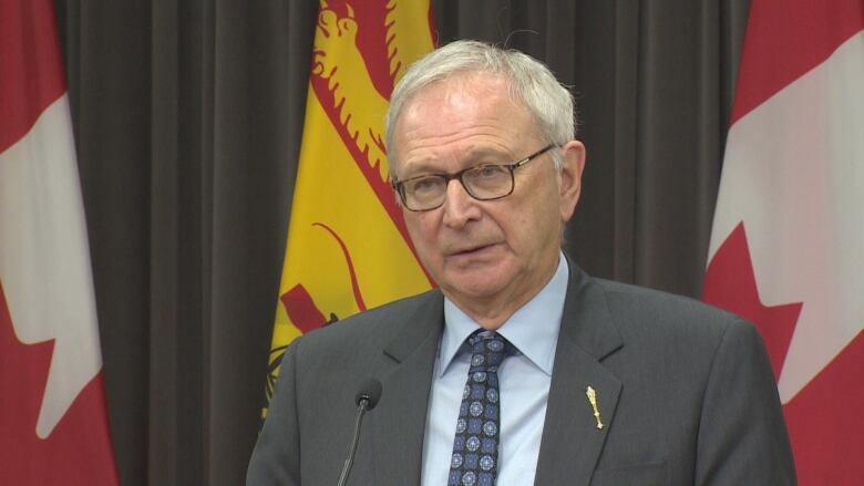 Premier Blaine Higgs speaks at a news conference.