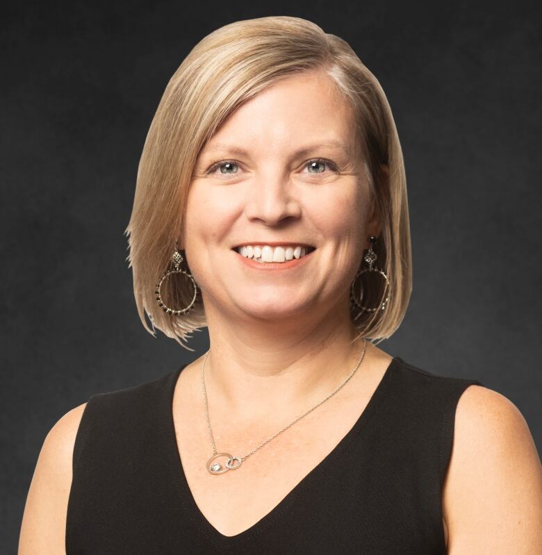 Dr. Shelley Duggan is an Edmonton-based critical care physician and the Alberta Medical Association's president-elect. She has blonde hair and is wearing a black v-neck blouse.