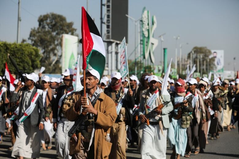 Newly recruited fighters who joined a Houthi military force intended to be sent to fight in support of the Palestinians in the Gaza Strip, march during a parade in Sanaa, Yemen December 2, 2023.