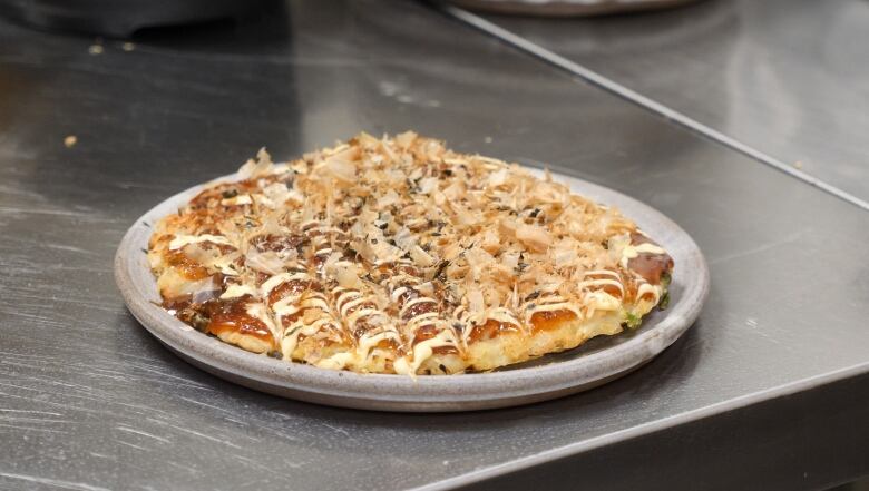 An Okonomiyaki (Japanese pancake) made by chef Ringo of the Tipsy Samurai restaurant in Regina.