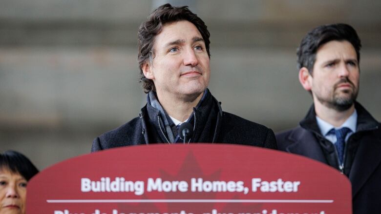 Prime Minister Justin Trudeau, centre, is joined by federal Housing Minister Sean Fraser, right, and Toronto Mayor Olivia Chow, left, at a funding announcement.