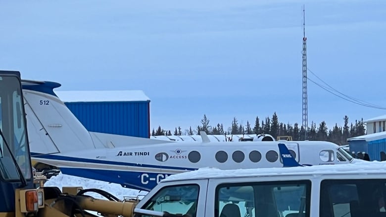 A plane amid machinery.