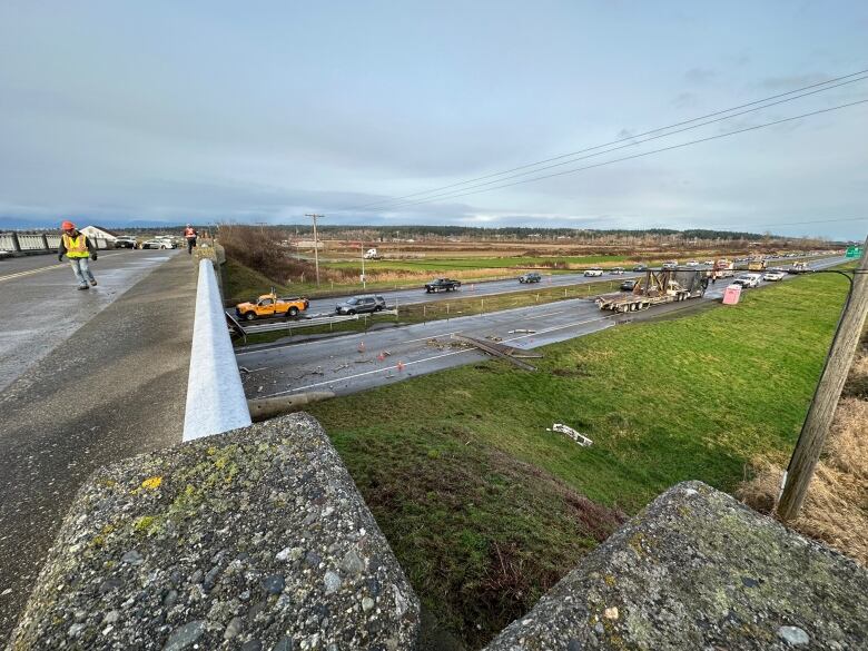 A highway closed with cars lined up in the distance.