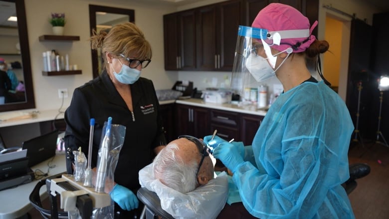 hygienist working on patient