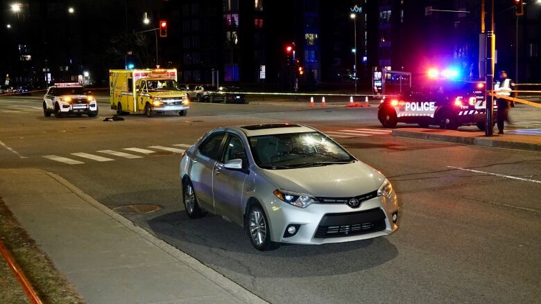 Scene of a hit-and-run at a major intersection at night. 