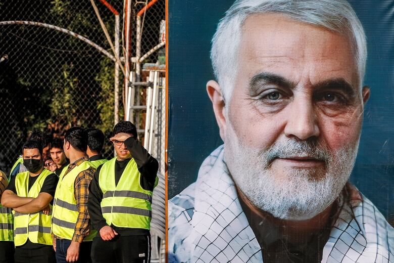 A large portrait of an older bearded man looking beatific is seen near men in green safety vests.