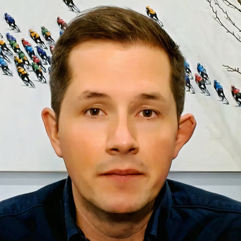 A close-up shot of a man with brown hair.