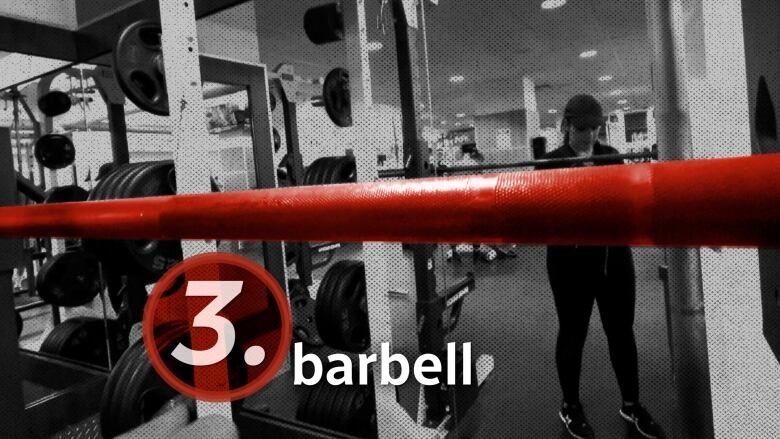 A woman stands in front of a barbell at the gym. In red text, it reads 