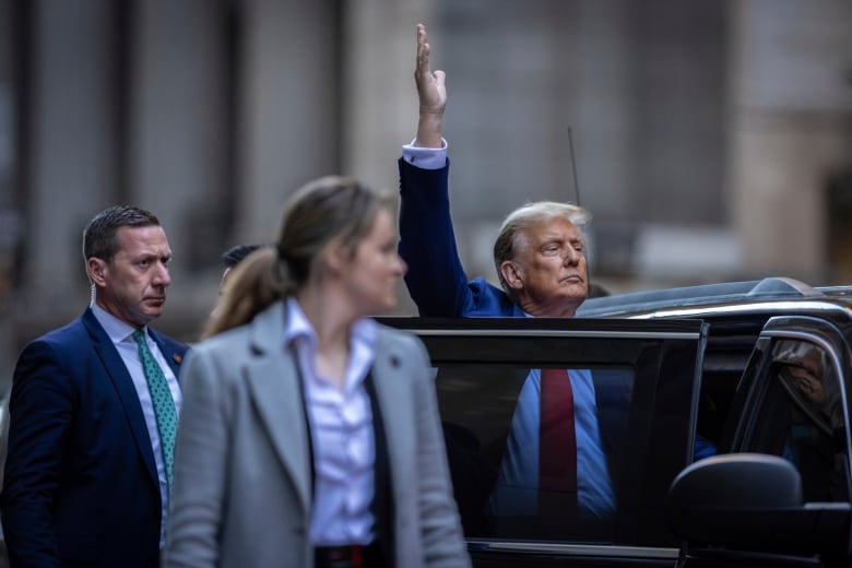 Former U.S. president Trump is seen outside 40 Wall Street in New York City.