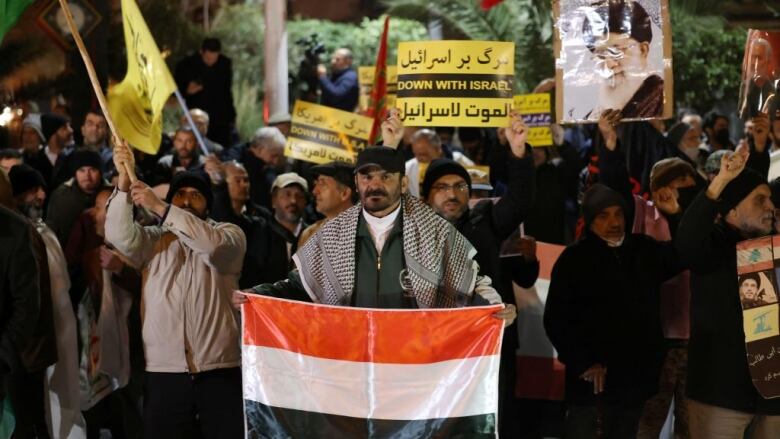 A protester holds a flag.