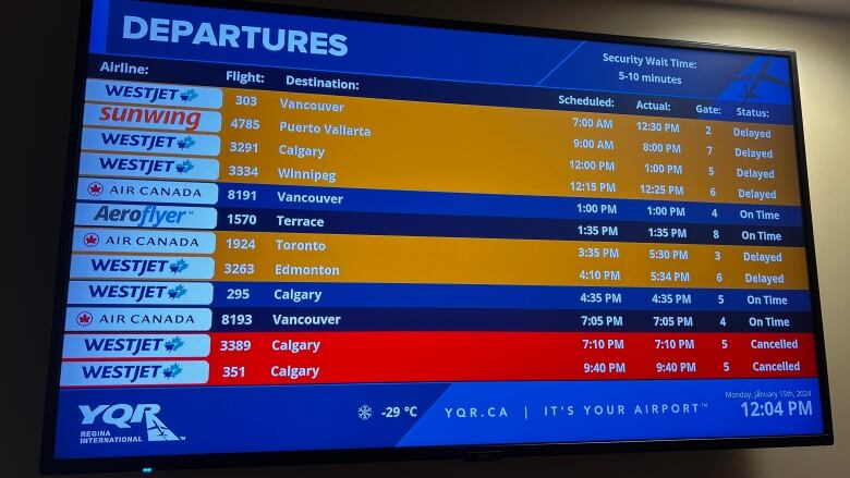 A board listing flights has six delayed flights and two cancelled flights on it.