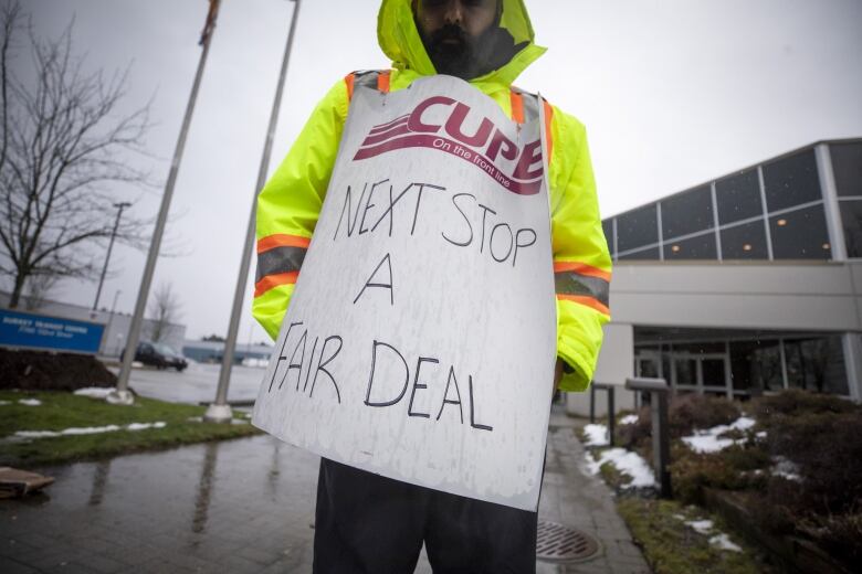 Members of CUPE 4500 are pictured at a picket line in Surrey, British Columbia on Monday, January 22, 2024. 