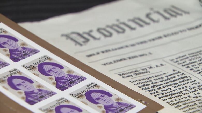 Purple stamps with a replica of a newspaper