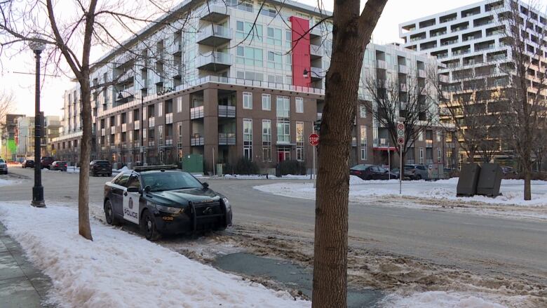 A police car parked on a street. 