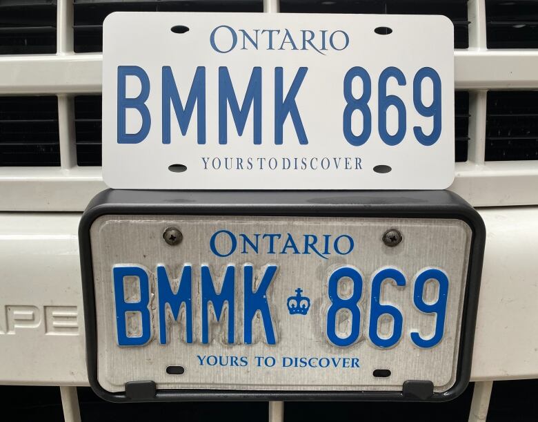 Fake Ontario licence plate sitting on top of real Ontario licence plate.