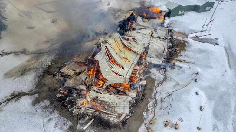 An aerial view of a burned down school. 