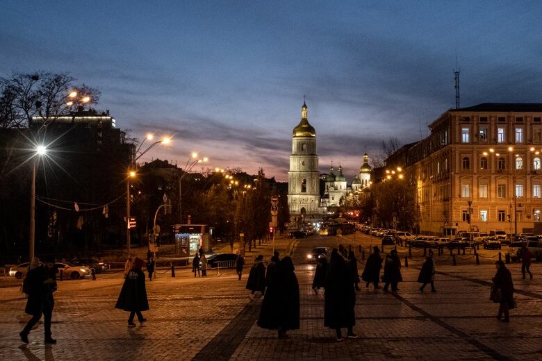 A file photo from Feb. 11, 2022, shows people strolling in front of Saint Sophia Cathedral in Kyiv, Ukraine.