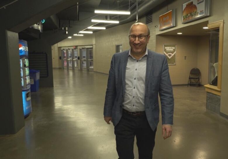 Man in a suit walking. 